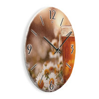 Kamille Design-Wanduhr aus Steinguss mit leisem Uhrwerk
